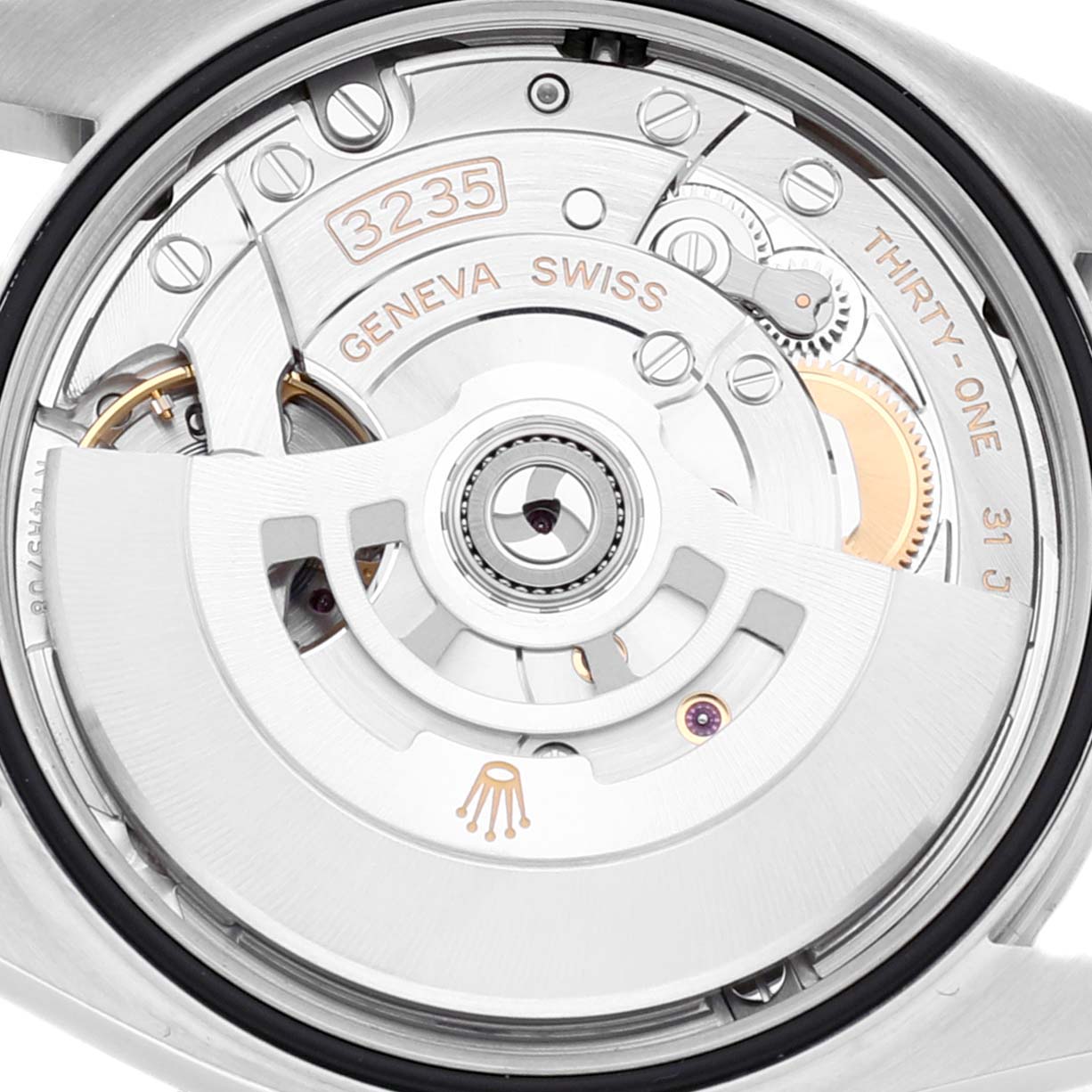 This image shows the movement mechanism of a Rolex Datejust 126234 Men's Stainless Steel Pink Dial 126234 Men's Stainless Steel Pink Dial watch from the back, highlighting the rotor, gears, and inscriptions.