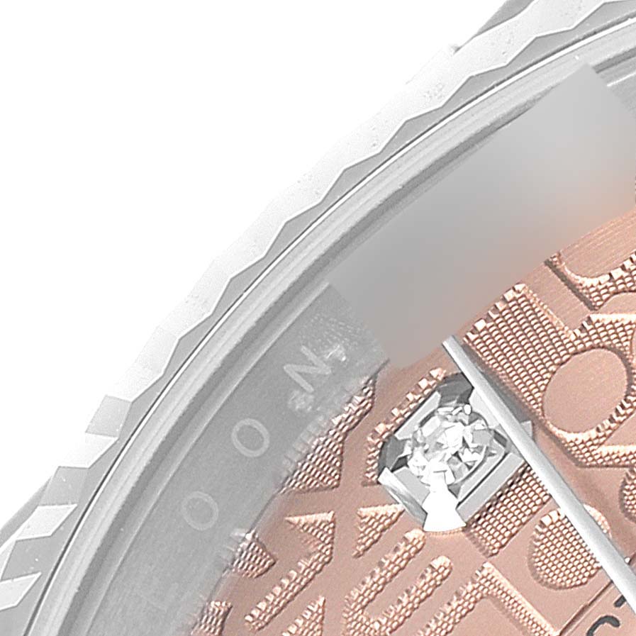 This image shows a close-up of the bezel, dial, and diamond marker of a Rolex Datejust 126234 Men's Stainless Steel Pink Dial 126234 Men's Stainless Steel Pink Dial watch.