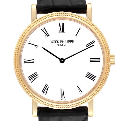 The image shows a front view of the Patek Philippe Calatrava 5120J Men's Yellow Gold White Dial 5120J Men's Yellow Gold White Dial watch, highlighting its Roman numeral dial and gold case.