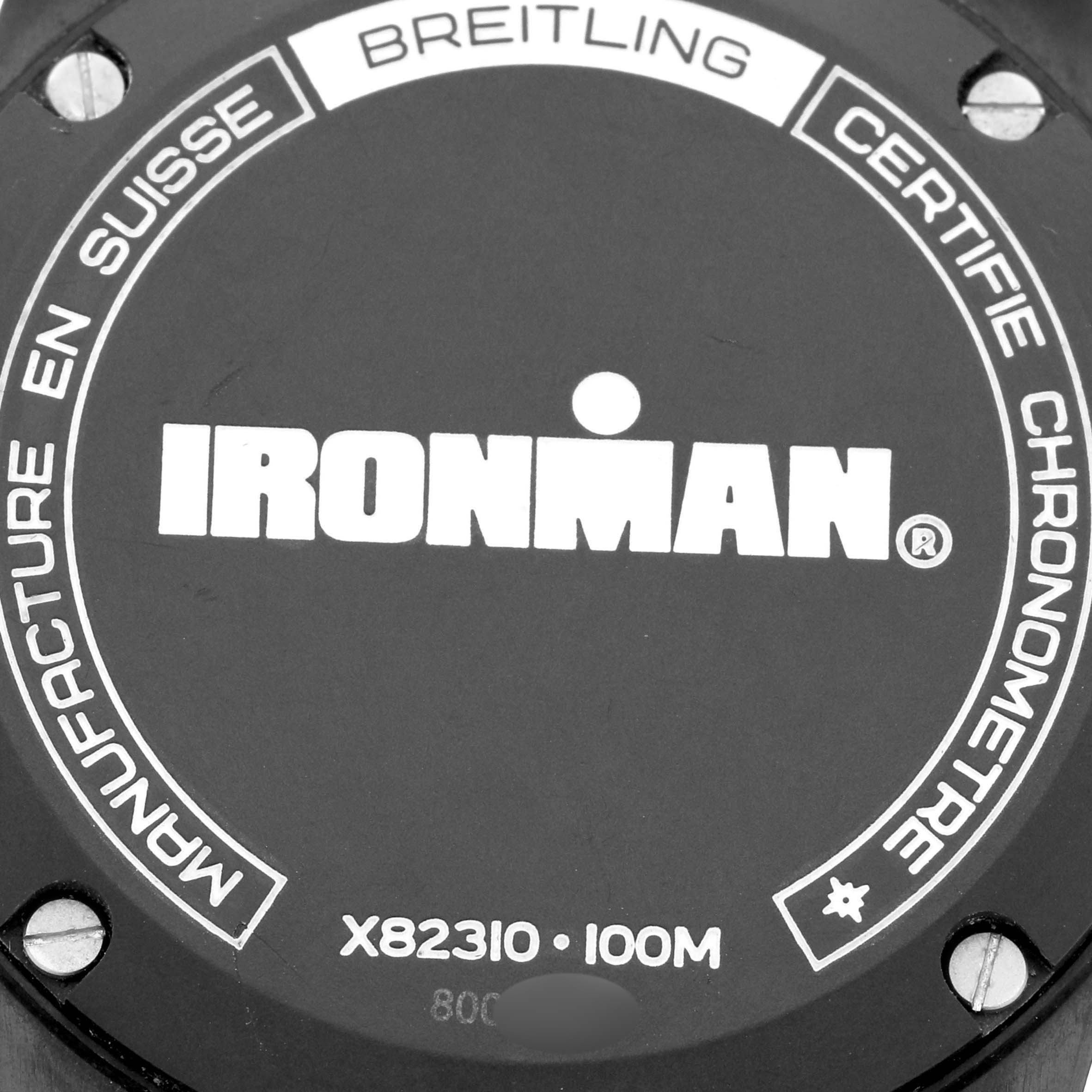 The image shows the back casing of a Breitling Professional Series X82310 Men's Ceramic Red Dial X82310 Men's Ceramic Red Dial Ironman model, detailing water resistance and certification.