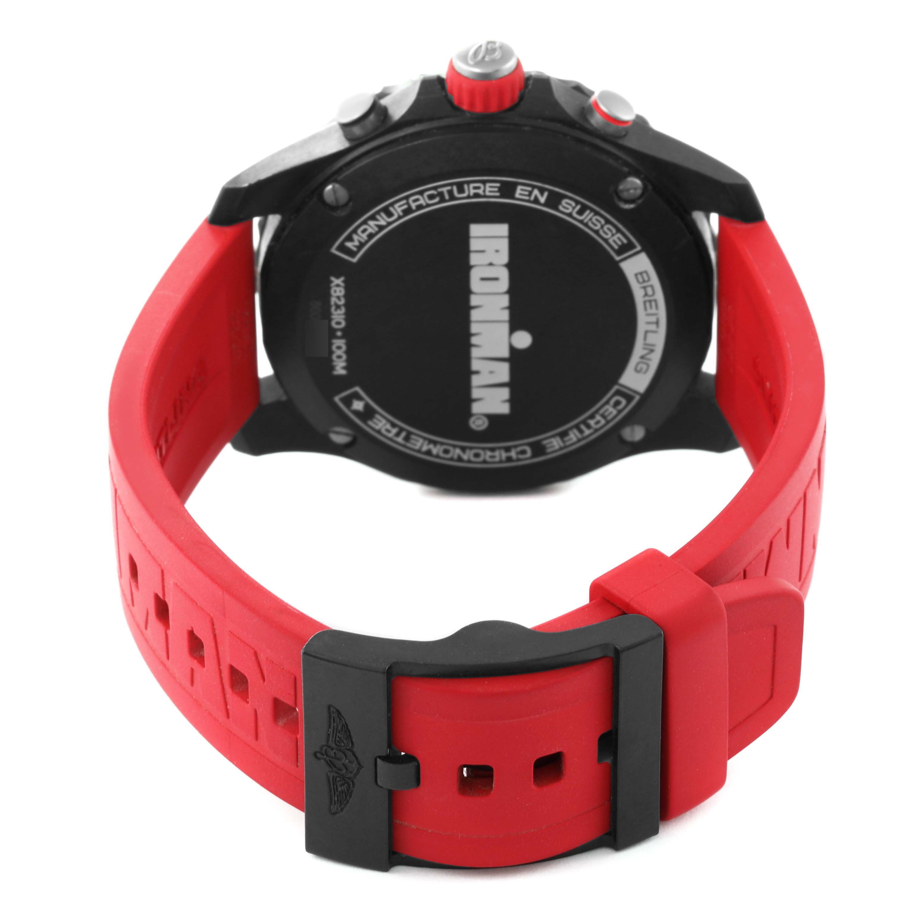 The Breitling Professional Series X82310 Men's Ceramic Red Dial X82310 Men's Ceramic Red Dial watch is shown from the back, highlighting its red wristband and the case back with the "Ironman" motif.