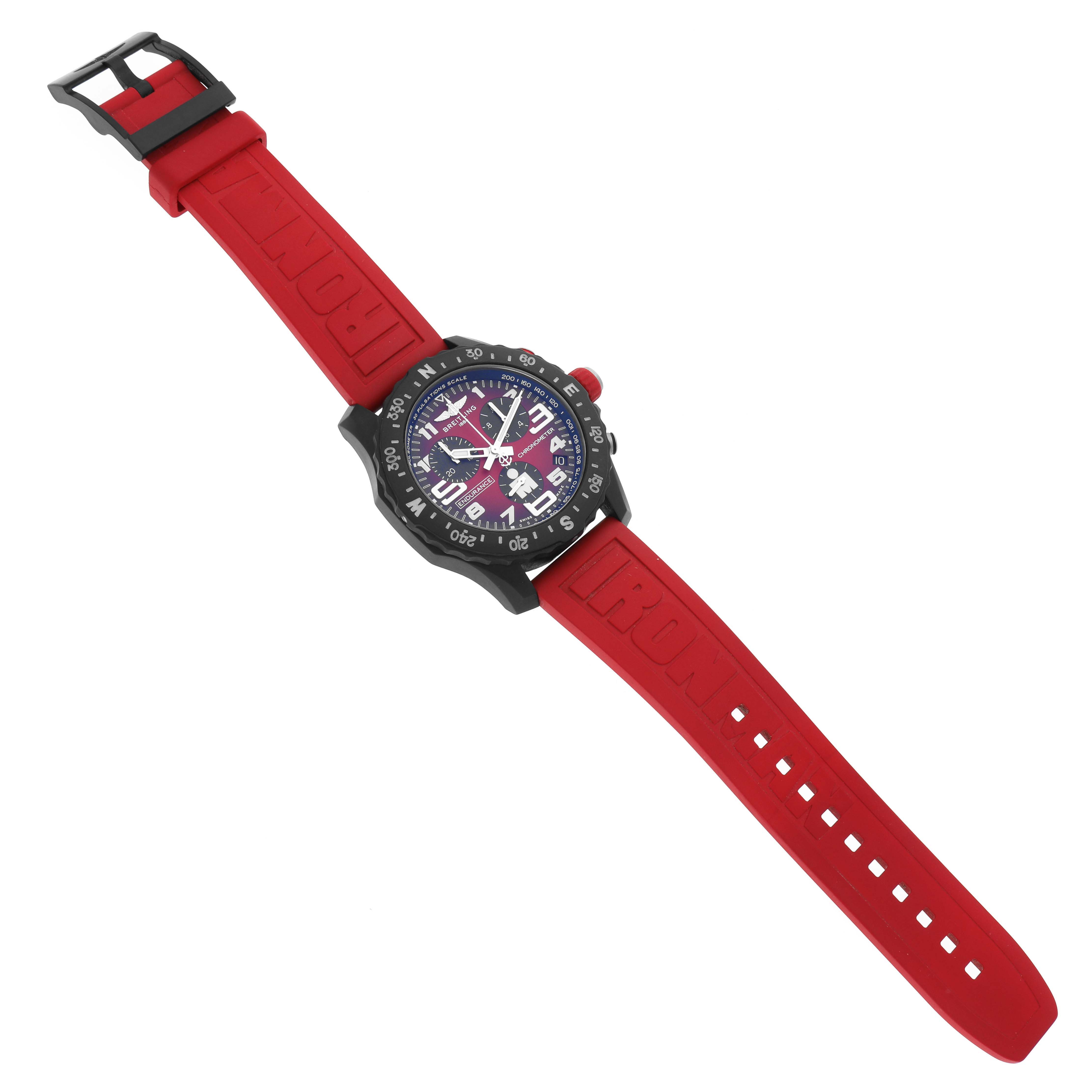 This Breitling Professional Series X82310 Men's Ceramic Red Dial X82310 Men's Ceramic Red Dial watch is shown from an overhead angle, featuring a red strap and a detailed dial.