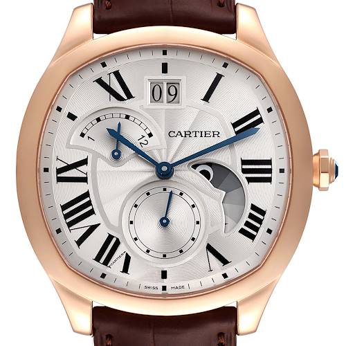 The image shows the face of a Drive de Cartier watch by Cartier, featuring Roman numerals and a brown leather strap.
