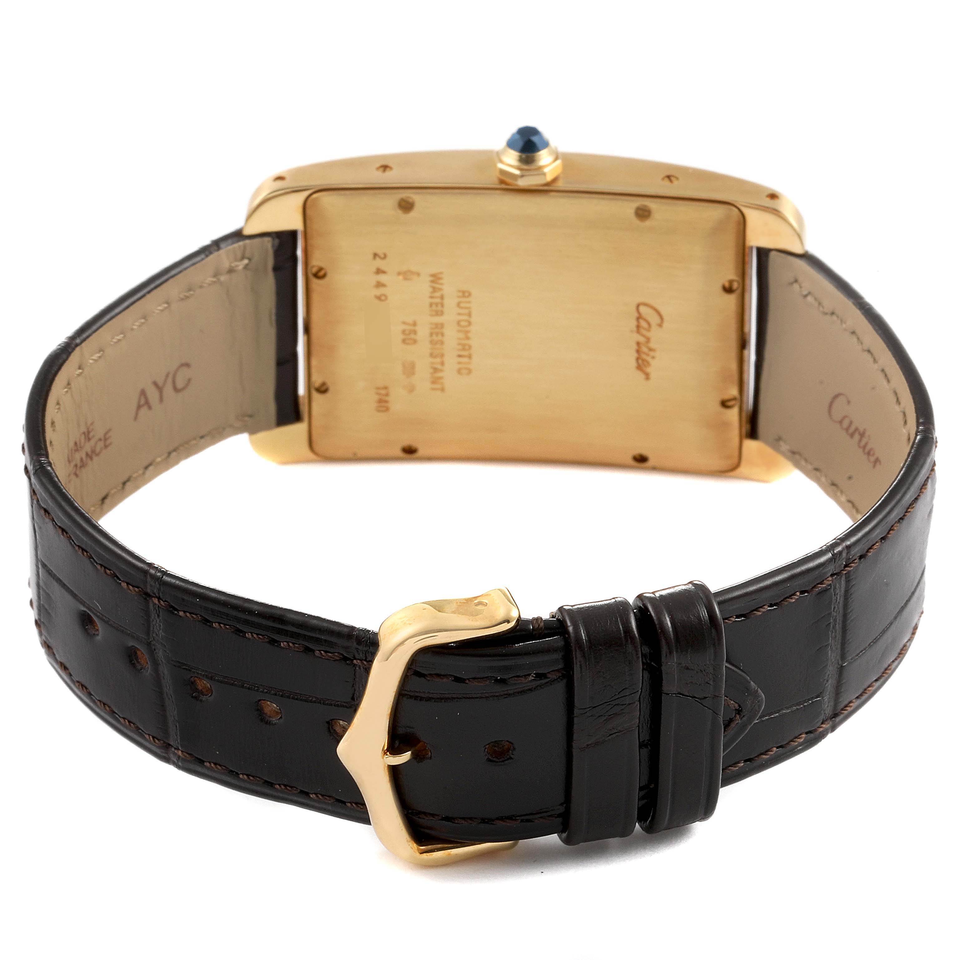 This image shows the back of the Cartier Tank Américaine watch, displaying the caseback, crown, and leather strap with buckle.