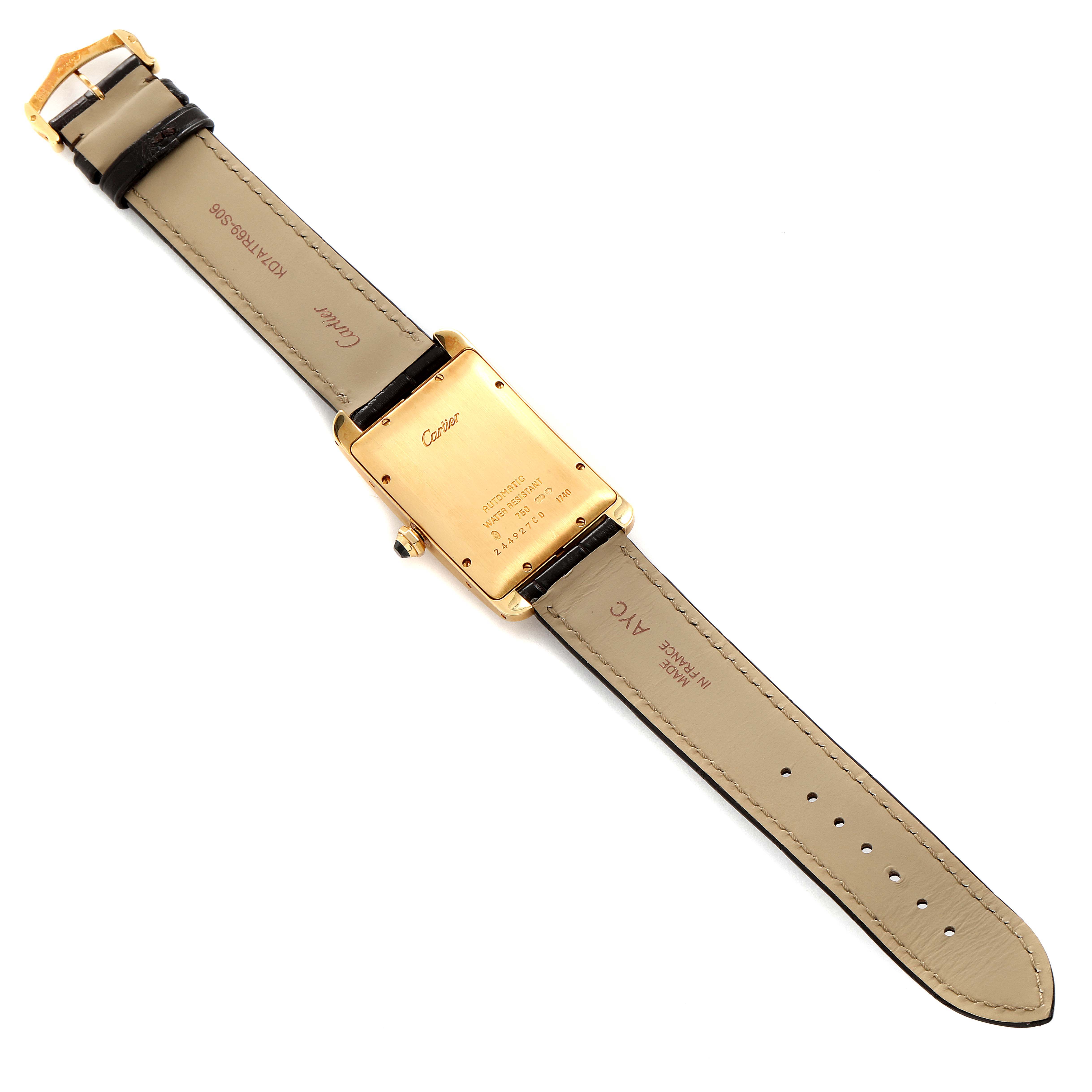 The image shows the back of the Cartier Tank Américaine watch, including its strap and buckle.