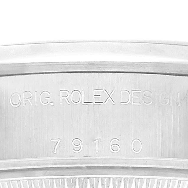 This image shows the side of a Rolex Date 79160 Women's Stainless Steel White Dial 79160 Women's Stainless Steel White Dial model, displaying the engraved case reference number and "ORIG. ROLEX DESIGN."