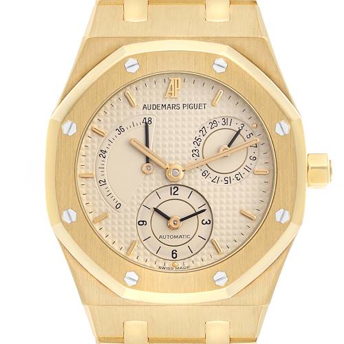 The Audemars Piguet Royal Oak 25730BA Men's Yellow Gold Beige Dial 25730BA Men's Yellow Gold Beige Dial watch is shown from a front angle, featuring its dial, subdials, and octagonal bezel.