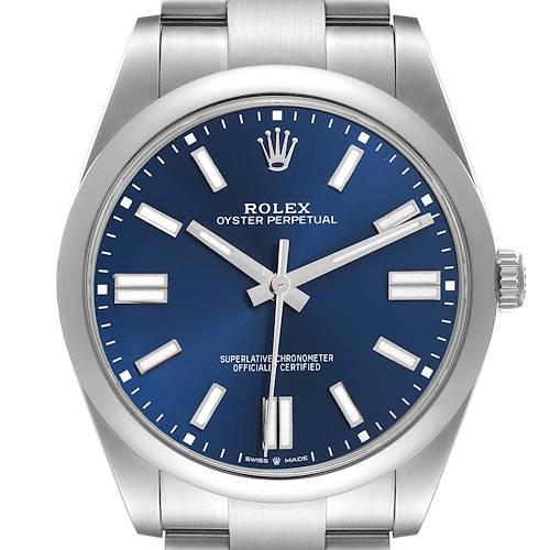 The Rolex Oyster Perpetual 124300 Men's Stainless Steel Blue Dial 124300 Men's Stainless Steel Blue Dial watch is shown from a front angle, highlighting its blue dial, silver markers, hands, and crown.