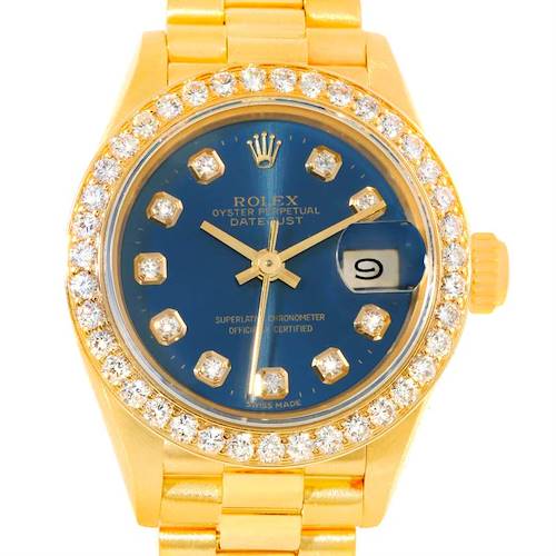 The Rolex President 69178 Women's Yellow Gold Blue Dial 69178 Women's Yellow Gold Blue Dial watch is shown from a top-down angle, highlighting its blue dial, diamond bezel, and gold bracelet.