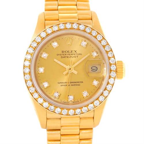 The image shows a front view of a Rolex President 69138 Women's Yellow Gold Champagne Dial 69138 Women's Yellow Gold Champagne Dial Datejust watch, highlighting its gold band, diamond bezel, and dial with date display.