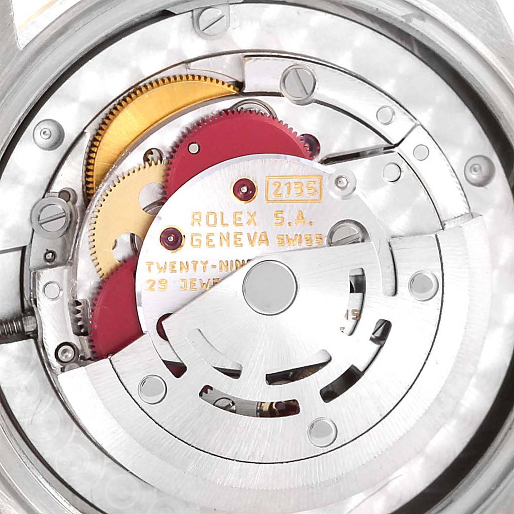 This image shows the movement mechanism of a Rolex President 68279 Women's White Gold Champagne Dial 68279 Women's White Gold Champagne Dial model watch, highlighting gears, rotors, and inscriptions.