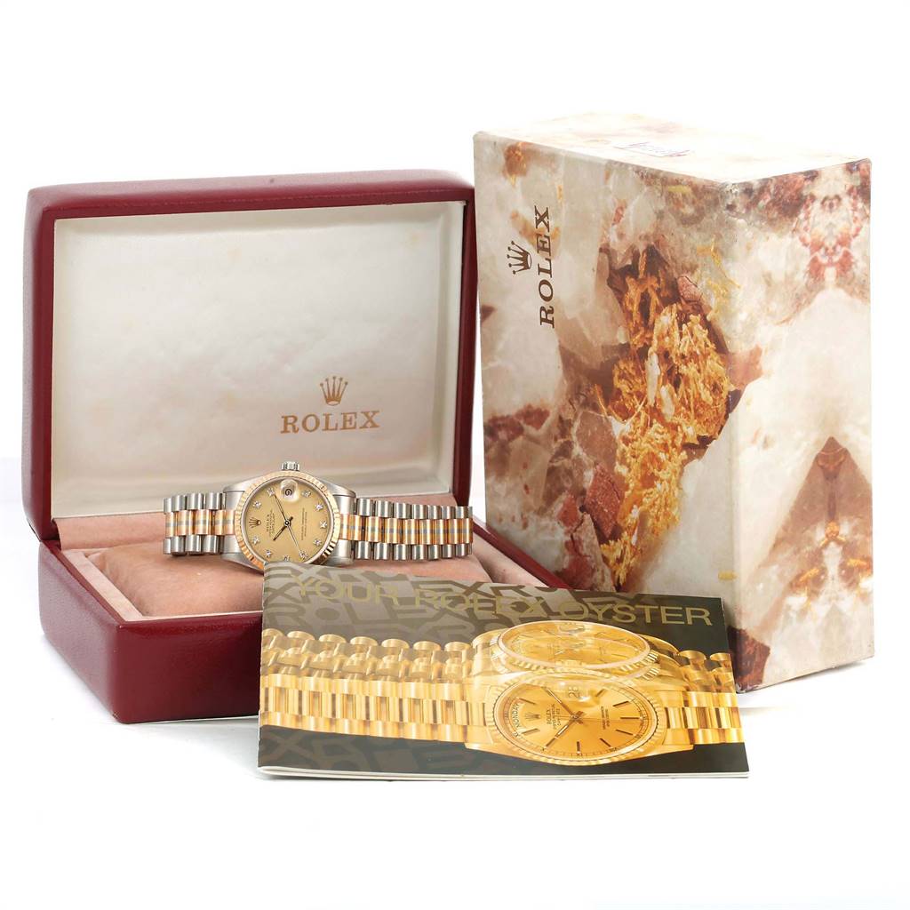 The Rolex President 68279 Women's White Gold Champagne Dial 68279 Women's White Gold Champagne Dial watch is shown in its open box with original packaging and brochure, viewed from the front.