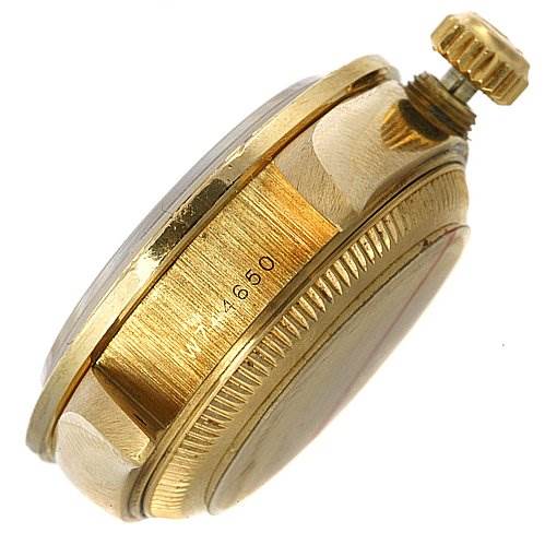 This image shows a side view of the Rolex President 69068 Women's Yellow Gold Mother of Pearl Dial 69068 Women's Yellow Gold Mother of Pearl Dial watch case and crown.
