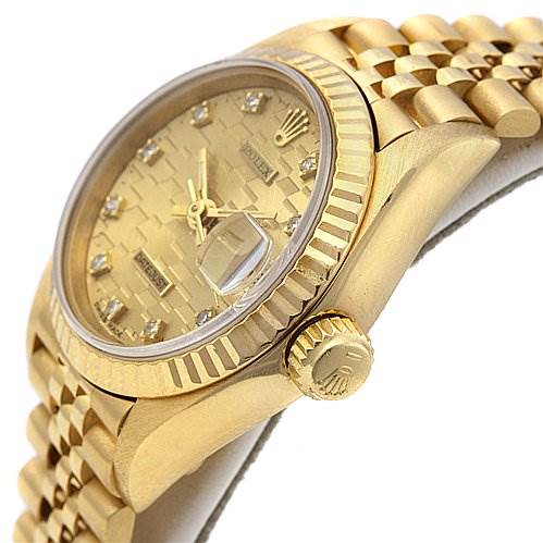 This image shows a side angle of the Rolex President 69178 Women's Yellow Gold Champagne Dial 69178 Women's Yellow Gold Champagne Dial model watch, highlighting the crown, bezel, case, and part of the bracelet.