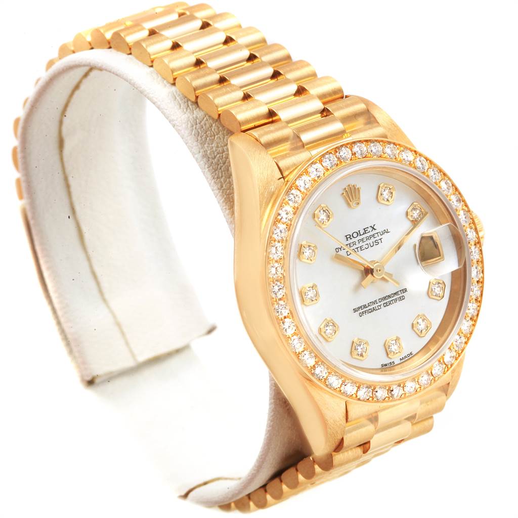 This image shows a Rolex President 69138 Women's Yellow Gold Mother of Pearl Dial 69138 Women's Yellow Gold Mother of Pearl Dial model watch at a slight angle, highlighting the dial, bezel, and part of the bracelet.