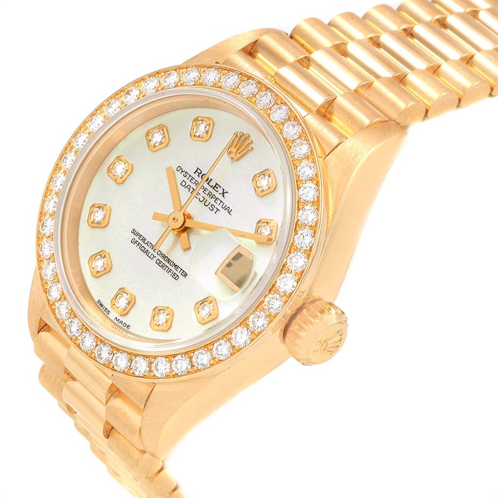 The Rolex President 69138 Women's Yellow Gold Mother of Pearl Dial 69138 Women's Yellow Gold Mother of Pearl Dial model watch is shown from an angled perspective, highlighting the dial, bezel, crown, and part of the bracelet.