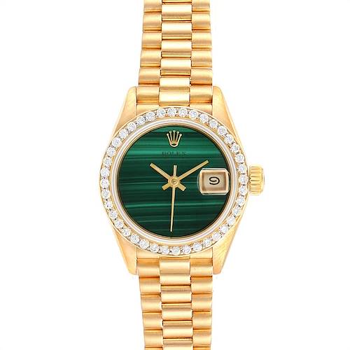 The image shows a Rolex President 69138 Women's Yellow Gold Green Dial 69138 Women's Yellow Gold Green Dial model watch from a top-down angle, highlighting the green dial, date window, and gold bracelet.