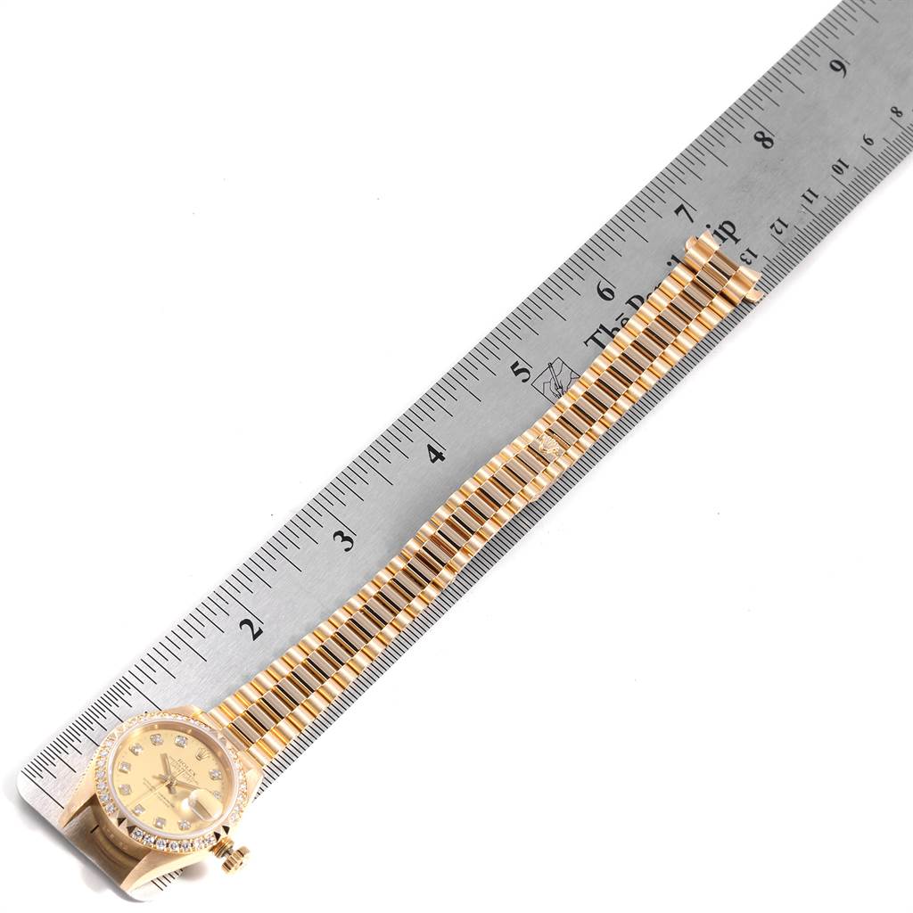 The image shows the President model Rolex watch, focusing primarily on the dial and bracelet, with the total length measured against a ruler.