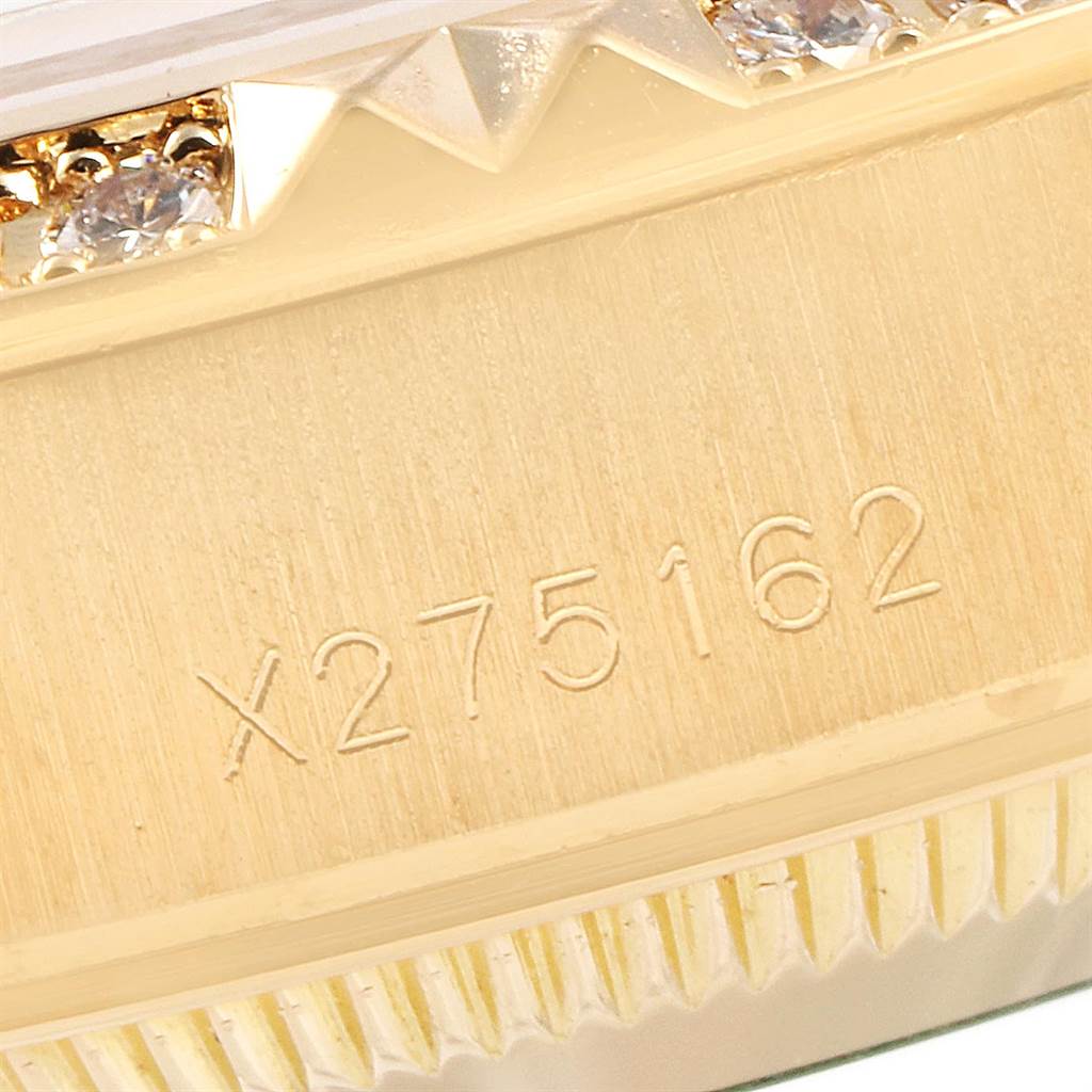 A close-up view of the Rolex President 69268 Women's Yellow Gold Champagne Dial 69268 Women's Yellow Gold Champagne Dial model showing the side case with its reference number and part of the diamond-studded bezel.