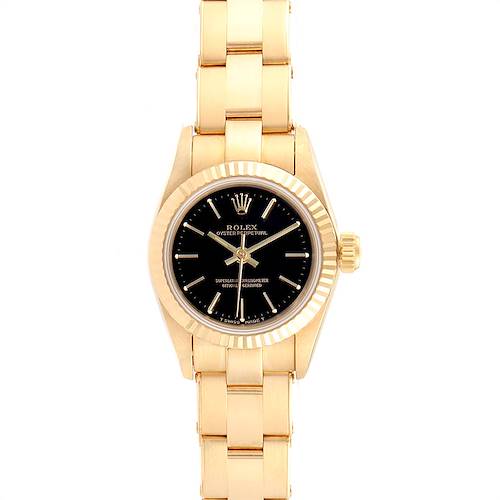 The President model Rolex watch is shown from a front angle, displaying its gold bracelet, black dial, and fluted bezel.