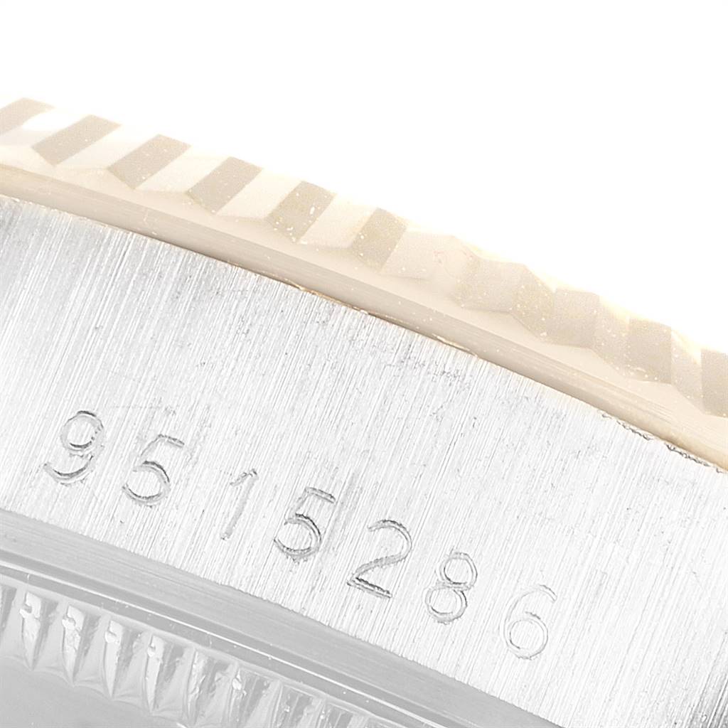 This close-up image of the Rolex President 68279 Women's White Gold Champagne Dial 68279 Women's White Gold Champagne Dial model shows the engraved serial number and part of the fluted bezel.