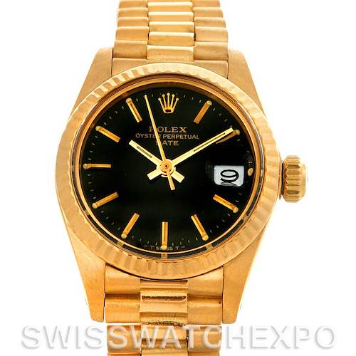 The image shows a frontal view of a Rolex President 6917 Women's Yellow Gold Black Dial 6917 Women's Yellow Gold Black Dial model watch, highlighting its black dial, bracelet, and fluted bezel.