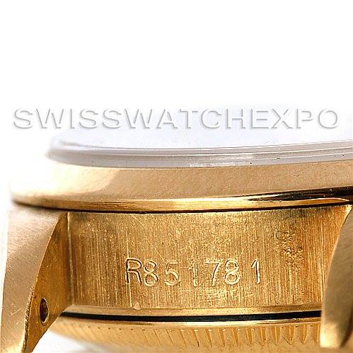 This image shows a close-up of the side of the Rolex President 67188 Women's Yellow Gold Blue Dial 67188 Women's Yellow Gold Blue Dial watch, highlighting the engraving on the gold case.