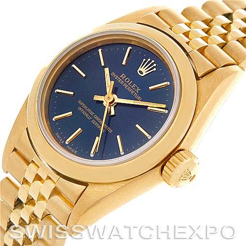 This image shows a close-up of the Rolex President 67188 Women's Yellow Gold Blue Dial 67188 Women's Yellow Gold Blue Dial model watch, featuring its gold case, blue dial, crown, and part of its bracelet.