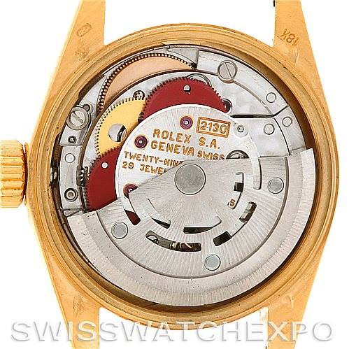 The image shows the open case back of a Rolex President 67188 Women's Yellow Gold Blue Dial 67188 Women's Yellow Gold Blue Dial model, displaying its intricate movement and inner components.