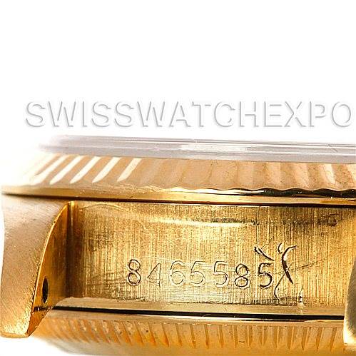 The image shows a close-up of the side of the Rolex President 67198 Women's Yellow Gold Blue Dial 67198 Women's Yellow Gold Blue Dial model, focusing on the serial number engraving on the case.