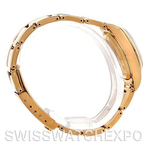 This side view of the Rolex President 67198 Women's Yellow Gold Blue Dial 67198 Women's Yellow Gold Blue Dial model watch showcases its bracelet and partially visible case.