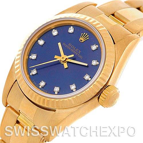 This image shows a close-up angled view of the Rolex President 67198 Women's Yellow Gold Blue Dial 67198 Women's Yellow Gold Blue Dial model watch, highlighting its gold case, blue dial, and diamond hour markers.