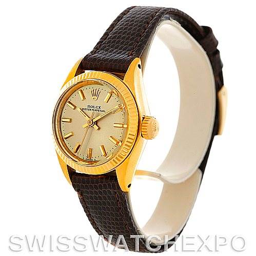 The image shows a Rolex President 6719 Women's Yellow Gold Champagne Dial 6719 Women's Yellow Gold Champagne Dial model watch at an angled side view, highlighting the face, bezel, crown, and leather strap.
