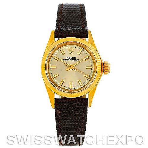 This image shows a front view of a Rolex President 6719 Women's Yellow Gold Champagne Dial 6719 Women's Yellow Gold Champagne Dial watch with a gold dial and a brown leather strap.