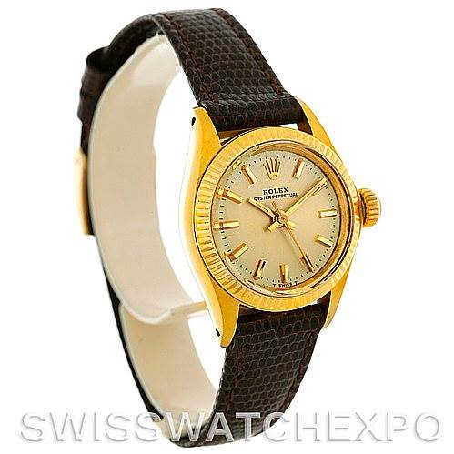 The Rolex President 6719 Women's Yellow Gold Champagne Dial 6719 Women's Yellow Gold Champagne Dial model is shown at a slight angle, displaying its gold case, dial, crown, and brown leather strap.
