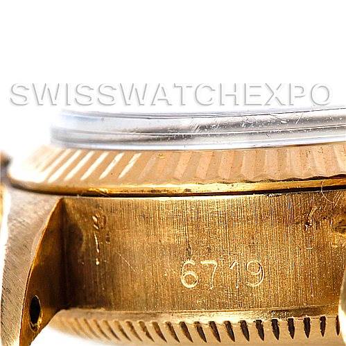 This image shows a close-up side view of a Rolex President 6719 Women's Yellow Gold Champagne Dial 6719 Women's Yellow Gold Champagne Dial model watch, focusing on the case with the model number "6719" engraved.