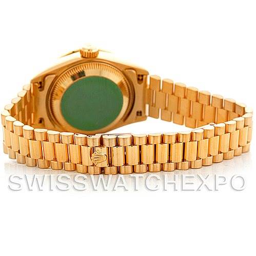 The image shows the back view of a Rolex President 69068 Women's Yellow Gold Mother of Pearl Dial 69068 Women's Yellow Gold Mother of Pearl Dial model watch, highlighting its gold bracelet and case back.