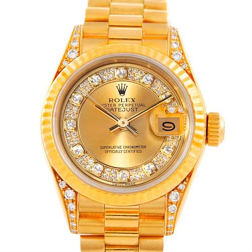The image shows a top-down view of a Rolex President 69238 Women's Yellow Gold Champagne Dial 69238 Women's Yellow Gold Champagne Dial model watch, highlighting its gold case, band, and diamond-encrusted bezel.