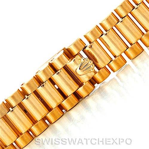 The image shows a close-up of the gold bracelet of the Rolex President 69138 Women's Yellow Gold Beige Dial 69138 Women's Yellow Gold Beige Dial model watch.