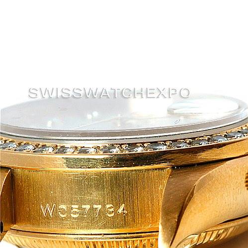 The image shows a side angle of a Rolex President 69138 Women's Yellow Gold Beige Dial 69138 Women's Yellow Gold Beige Dial model watch, highlighting the engraved serial number and part of the bezel.
