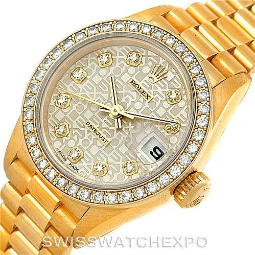 This image shows a Rolex President 69138 Women's Yellow Gold Beige Dial 69138 Women's Yellow Gold Beige Dial model watch from an overhead angle, featuring the dial, bezel, and part of the bracelet.