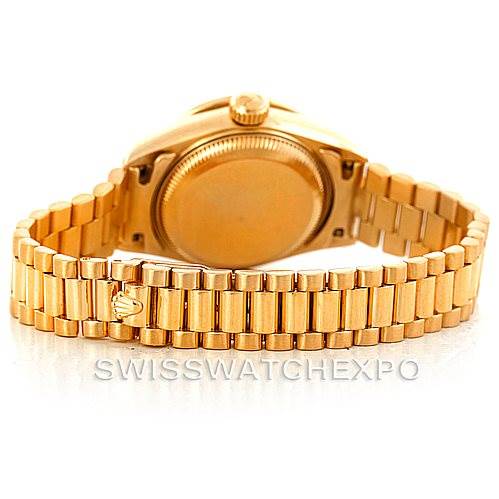 This image shows the back case and bracelet of a Rolex President 69138 Women's Yellow Gold Beige Dial 69138 Women's Yellow Gold Beige Dial model watch at a rear angle.