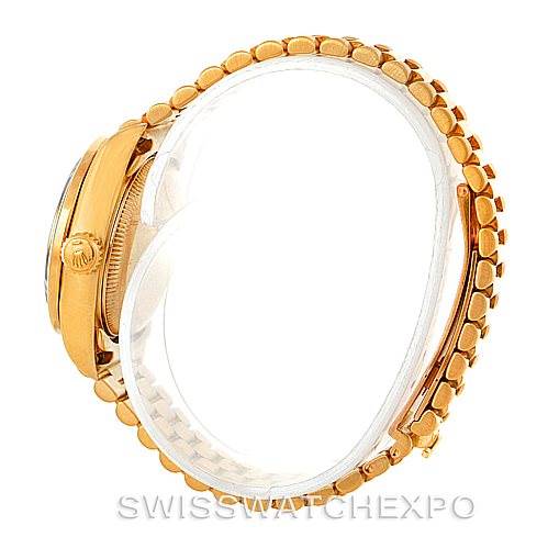 The image shows a side view of a Rolex President 69138 Women's Yellow Gold Beige Dial 69138 Women's Yellow Gold Beige Dial model, highlighting the case and bracelet links.