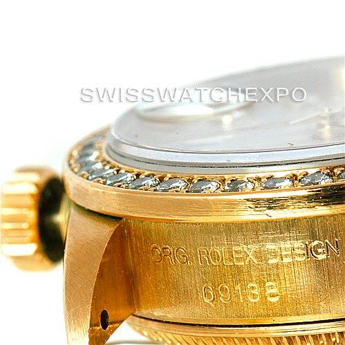 The image shows a close-up side view of the Rolex President 69138 Women's Yellow Gold Beige Dial 69138 Women's Yellow Gold Beige Dial watch, highlighting the bezel, crown, and case with model number engraving.