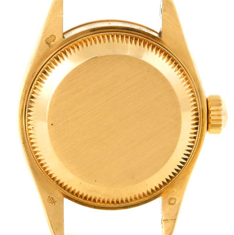 This image shows the case back and crown of a Rolex President 69178 Women's Yellow Gold Beige Dial 69178 Women's Yellow Gold Beige Dial model watch from a rear angle.