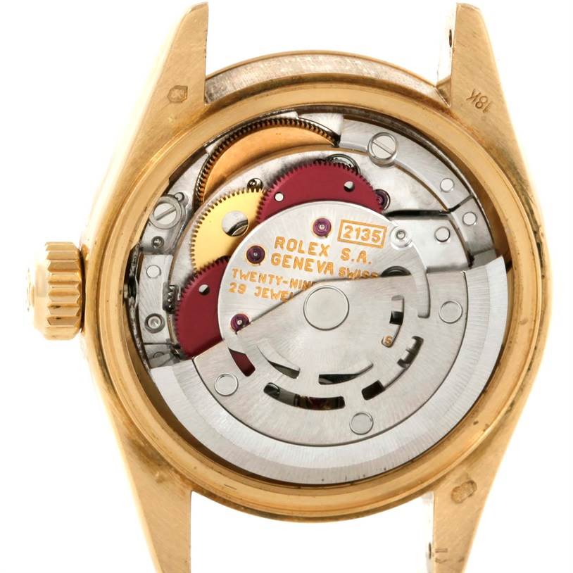 This is the interior mechanism view of a Rolex President 69178 Women's Yellow Gold Beige Dial 69178 Women's Yellow Gold Beige Dial model watch, showcasing the movement parts.