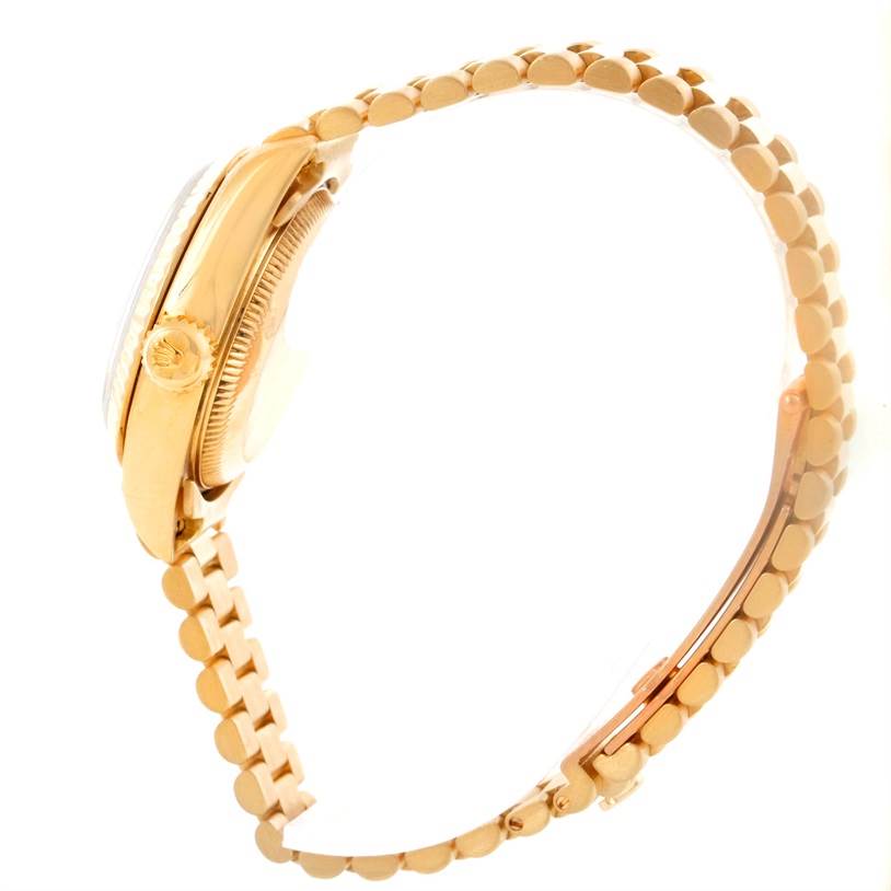 This image shows a Rolex President 69178 Women's Yellow Gold Beige Dial 69178 Women's Yellow Gold Beige Dial model watch from a side angle, highlighting the crown, case, and bracelet.