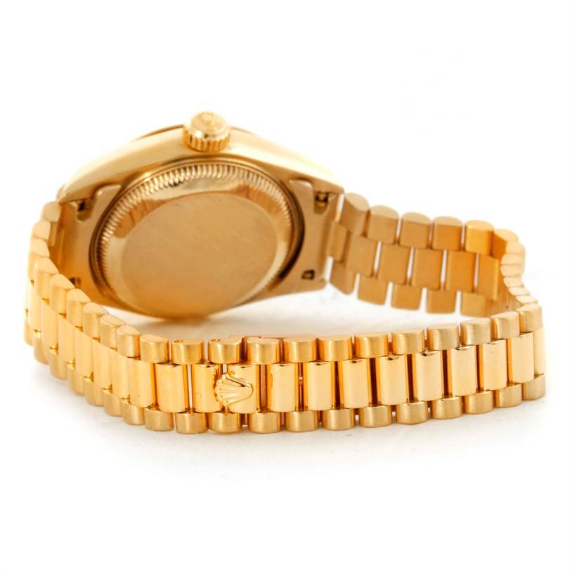 The image shows the back case and part of the bracelet of a Rolex President 69178 Women's Yellow Gold Beige Dial 69178 Women's Yellow Gold Beige Dial model watch from a rear angle.