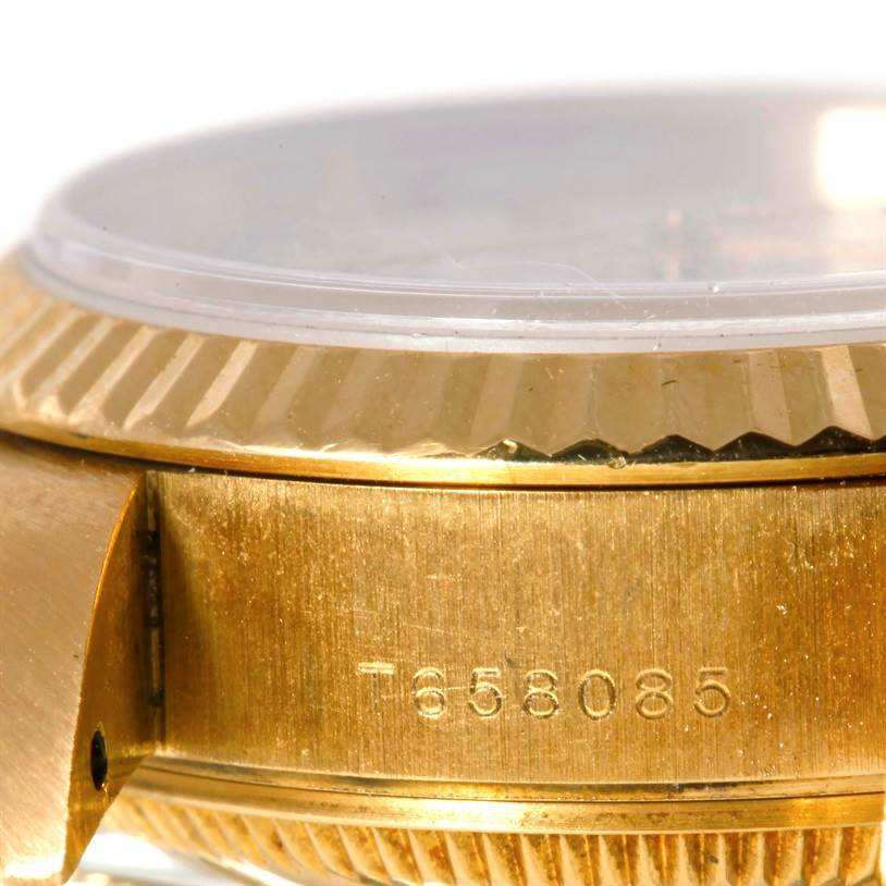 This image shows a close-up side view of the Rolex President 69178 Women's Yellow Gold Beige Dial 69178 Women's Yellow Gold Beige Dial model watch, highlighting the case and bezel's gold details.