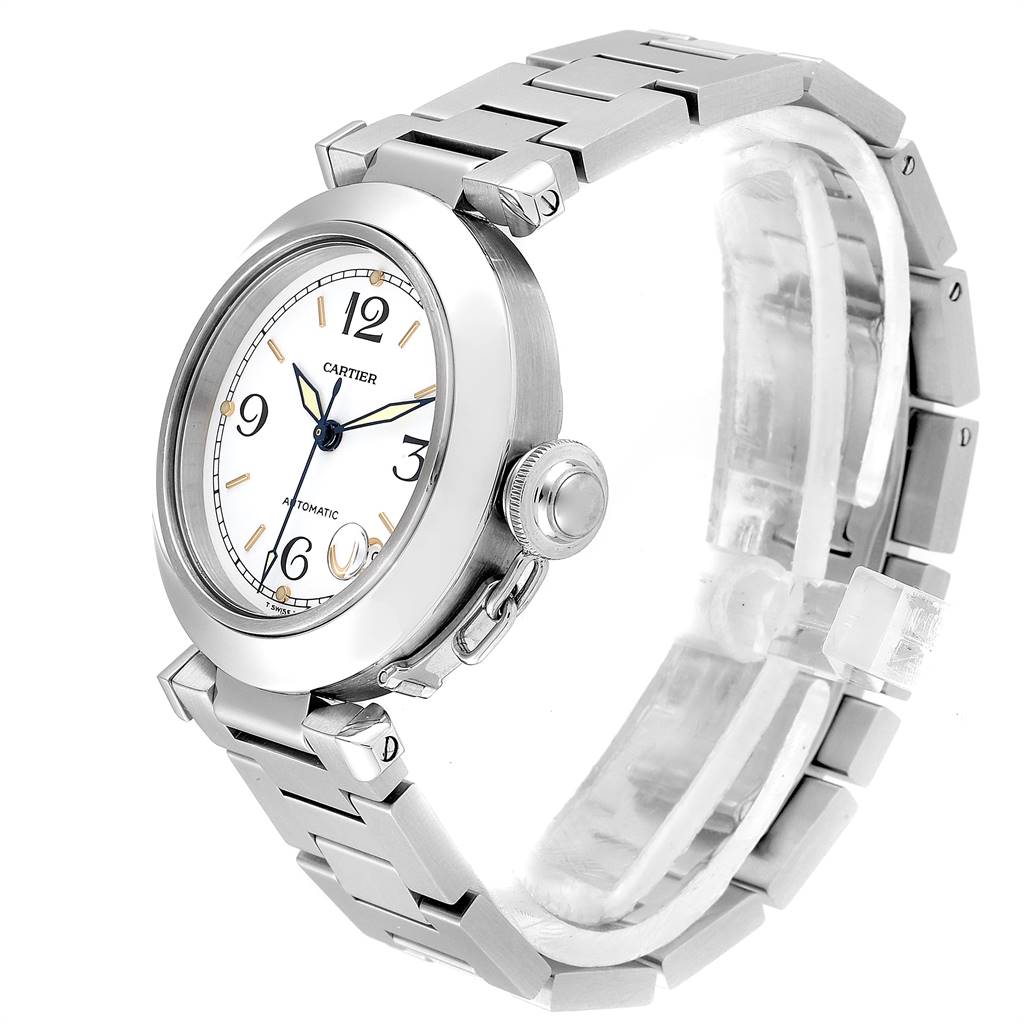 The image shows a Pasha model by Cartier from a front-side angle, highlighting the watch face, crown, and metal bracelet.